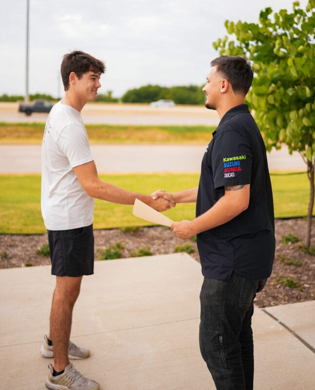 UBDparts employee shaking hands with customer